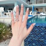 Chandler Lovelle Instagram - 💍"it's not just a boulder! It's a rock!!"🙈💕 said yes to the love of my life!!! This man got permission from the owners of my grandparent's old house and proposed to me in the backyard 😭 the shock and emotions I felt pulling into their driveway again...Needless to say, I was sobbingggg 😭 he incorporated the most special people that he never even got to meet so they could be there in spirit for this unreal life moment🥹 and in my favorite place in the whole world 😭 the most special, jaw-dropping proposal of all time. I love you more than anythinggg @nnickrichmann ! My FIANCÉ!!! Ahhh! Thank you for being the most loving generous person in the worldddd and for this impeccable surprise! 💍May 30, 2024 Thank you to the new owners for letting him plan this hahaha and HUGEEE thank you to @alex_mcco for snapping the most stunning pictures I've ever seen and getting eaten by mosquitos!! #proposal #isaidyes #kitediamond