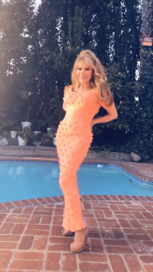 Charo Instagram - Hola Amigos . In Case that You wake up Today feeling Like: EL TORO POO-POO . This is My Solution . Dress Hot, Enjoy the Nature.Pay Attention to the Flowers and Eat. Lot of Chocolate .PS . I Hope You Like My Dress. I Love You All  Besos . #Charo #cuchicuchi #cute #hot #spring #fashion #camp #sexy #sun #sunday #dress #orange #California #beverlyhills #explorepage #fyp #foryoupage #loveyou