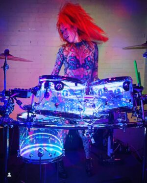 Chastity Ashley Instagram - Every victorious warrior draws their strength from the highest source; their love.
.
Such aaaaa moment out here on the road doing what I do to elevate you. Special thanks to the incredible souls of @secretdisco.society ya’ll know how to throw a party! Can’t wait to come back. 
.
#dj #drummer #percussionist #producer #beatmaker #worldtraveler #roadwarrior #redhead #neonpony