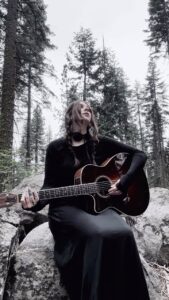 Chelsea Wolfe Instagram - bit of a cold but felt like singing in the forest #whispersintheechochamber