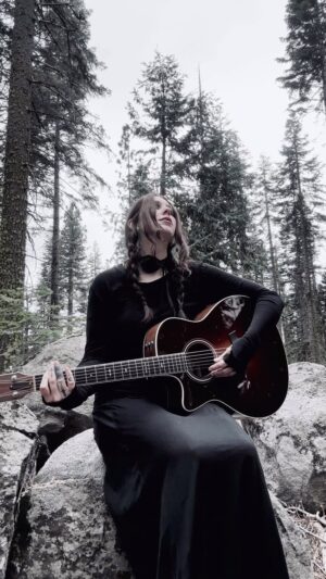 Chelsea Wolfe Instagram - bit of a cold but felt like singing in the forest #whispersintheechochamber