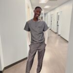 Cheryl 'Coko' Gamble Instagram - He had fun on tour but it’s back to work!!! @jayyemichael you are a handsome & fly dental assistant! 😍😍 Come on scrubs! 😂 #dentalassistant #GoJayye #proudmom