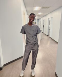 Cheryl 'Coko' Gamble Instagram - He had fun on tour but it’s back to work!!! @jayyemichael you are a handsome & fly dental assistant! 😍😍 Come on scrubs! 😂 #dentalassistant #GoJayye #proudmom