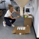 Cheryl Hines Instagram - At Hines Young we use cornstarch packing peanuts (not styrofoam!). I'm at the warehouse packing some products. My brother Mike isn't sure of my peanut skills! #hinesyoung #selfcare #familyowned #nosingleuseplastic #affordable #luxury www.shophinesyoung.com