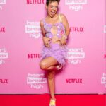 Chloé Hayden Instagram - It was free dress day for a gold coin donation and the theme was Polly Pocket (Thank you so so so much for all the love on Season 2 so far it’s making my heart go weeee) Stylist: @jordanboorman Wearing: @moniquemarschner @sarahgardnerjewellery @fluevog @autisticjewellery (and friendship bracelets made by you guys 🥺) HMUA: @bylolawithlove @heathmassihair