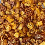 Christina Tosi Instagram - It’s FRIIIIDAY #BakeClub and we’re making something for a movie night so get cozy! Cheese Pizza Snack Mix Recipe is here and on christinatosi.com - let’s GO Makes about 4 cups 6 tablespoons unsalted butter 2 tablespoons tomato paste  1 tablespoon Worcestershire sauce  1 tablespoon sugar 1 teaspoon oregano or basil 1 teaspoon garlic powderc ½ teaspoon onion powder ¼ teaspoon salt 2 cups cereal (think: Cornflakes, Honeycombs, Chex, etc) 2 cups salty snacks (think: Fritos, pretzels, crackers, etc) 2 tablespoons grated parmesan cheese  pepperoni pizza slices, red pepper flakes, ranch mix, etc. if you want to take it further  Heat the oven to 250F and grease or line a baking sheet.  In a small bowl, melt the butter. Whisk in tomato paste, Worcestershire sauce, sugar, oregano, garlic, onion and salt. Pour into a large bowl and toss with the cereal until well coated. Spread this mixture across the baking sheet and bake for 50 minutes, tossing every 10 minutes to ensure an even toasting. At 50 minutes, sprinkle parmesan cheese atop mixture and bake for an additional 10 minutes. Cool mixture completely on baking sheet before transferring to one or several bowls or baggies to snack on!
