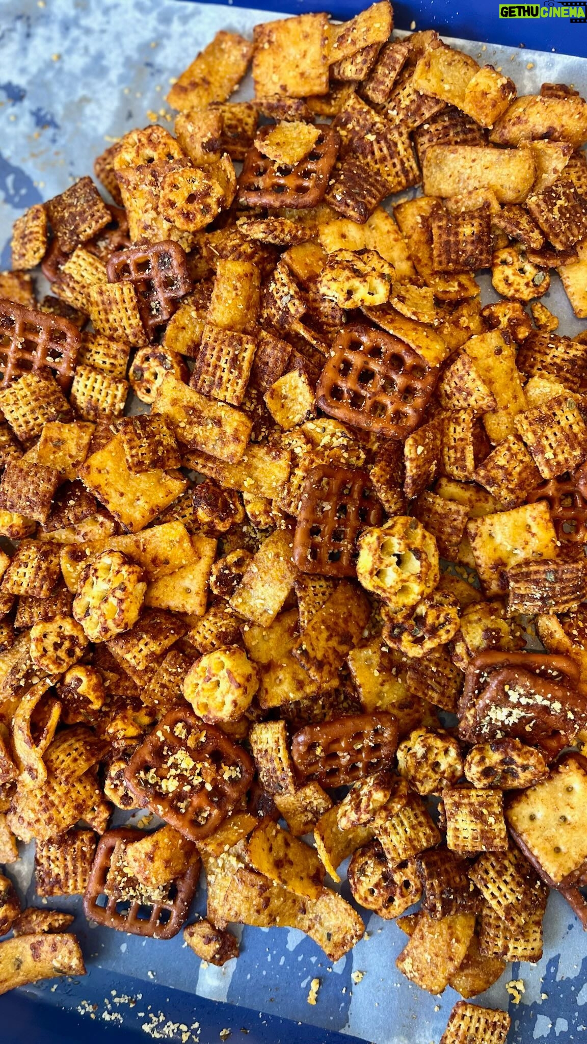 Christina Tosi Instagram - It’s FRIIIIDAY #BakeClub and we’re making something for a movie night so get cozy! Cheese Pizza Snack Mix Recipe is here and on christinatosi.com - let’s GO Makes about 4 cups 6 tablespoons unsalted butter 2 tablespoons tomato paste 1 tablespoon Worcestershire sauce 1 tablespoon sugar 1 teaspoon oregano or basil 1 teaspoon garlic powderc ½ teaspoon onion powder ¼ teaspoon salt 2 cups cereal (think: Cornflakes, Honeycombs, Chex, etc) 2 cups salty snacks (think: Fritos, pretzels, crackers, etc) 2 tablespoons grated parmesan cheese pepperoni pizza slices, red pepper flakes, ranch mix, etc. if you want to take it further Heat the oven to 250F and grease or line a baking sheet. In a small bowl, melt the butter. Whisk in tomato paste, Worcestershire sauce, sugar, oregano, garlic, onion and salt. Pour into a large bowl and toss with the cereal until well coated. Spread this mixture across the baking sheet and bake for 50 minutes, tossing every 10 minutes to ensure an even toasting. At 50 minutes, sprinkle parmesan cheese atop mixture and bake for an additional 10 minutes. Cool mixture completely on baking sheet before transferring to one or several bowls or baggies to snack on!