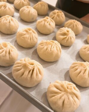 Christine Ko Instagram - I have a personal goal of learning how to cook all my fav dishes from childhood 🧡 Here’s what’s made the list so far:

- sheng jian bao (have yet to learn how to wrap them as beautifully as my mom’s that I’m holding) 
- braised pork shank 
- cold sesame noodles 
- hot and sour soup 
- stewed duck & mustard greens 
- the OG beef noodle soup 

Anyone wanna come over for din? 🙋🏻‍♀️
