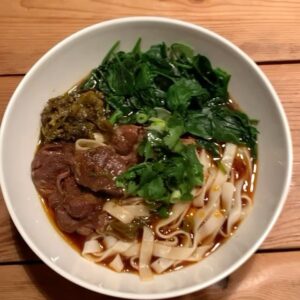 Christine Ko Instagram - I have a personal goal of learning how to cook all my fav dishes from childhood 🧡 Here’s what’s made the list so far:

- sheng jian bao (have yet to learn how to wrap them as beautifully as my mom’s that I’m holding) 
- braised pork shank 
- cold sesame noodles 
- hot and sour soup 
- stewed duck & mustard greens 
- the OG beef noodle soup 

Anyone wanna come over for din? 🙋🏻‍♀️
