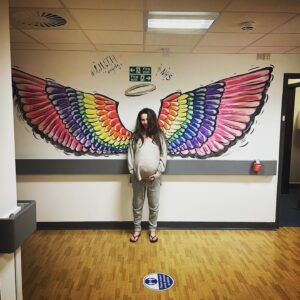 Claire Cooper Instagram - Not quite an Angel …..

Just over 3 weeks ago heavily pregnant- A pinch myself moment … I paced the corridors & heard the bliss of newborns being born … that first cry is AMAZING, I found myself wondering how our birth would turn out … we experienced so many twists & turns … it was wild! Defo not what we planned but it was still phenomenal 

Pregnant ladies if your surges slow or taper off - GET ON YOUR FEET & ground yourself & listen to your body … it whispers & then it roars!!! Tune in ❣️

Sending love to all expectant mothers & sending so many thanks again to everyone at Arrowe Park Hospital I’m so grateful to you all for holding such a safe optimistic space for us 🙏

❤️💛💚🧡💜💙 #pregnantthrowback #arroweparkhospital #grateful