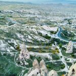 Clare Waight Keller Instagram - After Istanbul the valleys of Cappadocia - what I didn’t do was go in a balloon which is what most people do - what I did do was hike valleys and rocks and discover this incredible place on foot. 1. Gérôme National Park 2. See at the end the most remote cafe I’ve ever been to 3. Fall in the desert 4. Remote refreshments fresh pomegranate juice with a spectacular view 5. @uniqlo :C white shirt with @uniqlo U men’s cargo pants 6/7. Out in the valley 8/9 Room with a view at sunrise 10 The Chimneys #travel #memories #inspiration #turkey #cappadocia #remote #life #restaurant #goals
