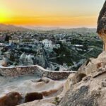 Clare Waight Keller Instagram - After Istanbul the valleys of Cappadocia - what I didn’t do was go in a balloon which is what most people do - what I did do was hike valleys and rocks and discover this incredible place on foot. 1. Gérôme National Park 2. See at the end the most remote cafe I’ve ever been to 3. Fall in the desert 4. Remote refreshments fresh pomegranate juice with a spectacular view 5. @uniqlo :C white shirt with @uniqlo U men’s cargo pants 6/7. Out in the valley 8/9 Room with a view at sunrise 10 The Chimneys #travel #memories #inspiration #turkey #cappadocia #remote #life #restaurant #goals