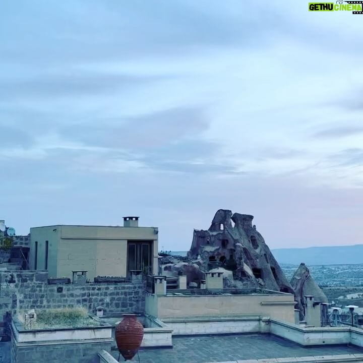 Clare Waight Keller Instagram - After Istanbul the valleys of Cappadocia - what I didn’t do was go in a balloon which is what most people do - what I did do was hike valleys and rocks and discover this incredible place on foot. 1. Gérôme National Park 2. See at the end the most remote cafe I’ve ever been to 3. Fall in the desert 4. Remote refreshments fresh pomegranate juice with a spectacular view 5. @uniqlo :C white shirt with @uniqlo U men’s cargo pants 6/7. Out in the valley 8/9 Room with a view at sunrise 10 The Chimneys #travel #memories #inspiration #turkey #cappadocia #remote #life #restaurant #goals