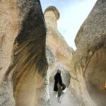 Clare Waight Keller Instagram - After Istanbul the valleys of Cappadocia - what I didn’t do was go in a balloon which is what most people do - what I did do was hike valleys and rocks and discover this incredible place on foot. 1. Gérôme National Park 2. See at the end the most remote cafe I’ve ever been to 3. Fall in the desert 4. Remote refreshments fresh pomegranate juice with a spectacular view 5. @uniqlo :C white shirt with @uniqlo U men’s cargo pants 6/7. Out in the valley 8/9 Room with a view at sunrise 10 The Chimneys #travel #memories #inspiration #turkey #cappadocia #remote #life #restaurant #goals
