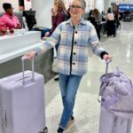 Clea Shearer Instagram - First time traveling with OUR OWN LUGGAGE COLLECTION!!! This color is positively sending me - and I didn’t even realize my jacket matched. 💟🦄🔮