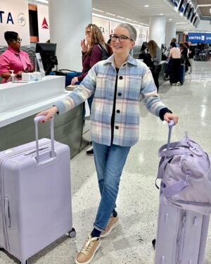 Clea Shearer Instagram - First time traveling with OUR OWN LUGGAGE COLLECTION!!! This color is positively sending me - and I didn’t even realize my jacket matched. 💟🦄🔮