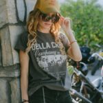 Cody Renee Cameron Instagram - Obsessed with women in the motorcycle community who support other women! @mrs_verhiel of @dellacrewco reached out to me 1 day and we had the loveliest convo about admiration, respect, & motorcycles. She said “I love what you’re doing how can I help?!” & I was blown away, because I thought, “GIRL, I love what YOU’RE doing SHEESH! What a BADASS! How can I be of service to YOU?!” She’s traveling around the world doing stunt shows & repping her dope motorcycle lifestyle clothing brand; I’m doubling for riders in tv shows and traveling around filming this motorcycle adventure show. We don’t see each other as adversaries, but rather as allies! She hooked me up with @mz.briwhite at @paradiseroadshow to snap some photos rocking her apparel and of course I was happy to oblige! I figure anyone she’s working with has to be just as cool & of course turns out Bri is just as rad and talented and supportive and it blows my mind how the web of support grows if you’re just out there being authentic, and open-minded, and humble. Keep creating, keep being kind, & the universe will open up to you! ❤️⚡️💀 and go check out @dellacrewco gear!!! 😎 Also rockin’ my @shewolfmotoco hat- another badass motorcycle ridin’ lady out here making the world a better place! 😻 Photocred @mz.briwhite Event @paradiseroadshow