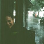 Conor Leslie Instagram – My brother & I took these of each other during a recent & aggressive summer rainstorm neither of us were prepared for. 
The 1st & 3rd were taken on film. 
The 2nd & 4th, taken on this tiny handheld computer we all use every day. 

And while the first you can only see half my face and the exposure isn’t quite right, and the third, he’s blurry and out of focus… I prefer both the film ones to the digital ones. 

Maybe that’s the unpopular opinion today. 

And yes, I still take a zillion photos on my iPhone. But I took comparison photos just to see them side by side and it proved, if I had to choose:

Film>digital any day.