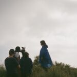 Courtney Barnett Instagram – Full-length visual accompaniment for End Of The Day directed by @oclaire available to watch now at the link in my bio. Huge thanks to this amazing film crew 💙💙💙
Director – Claire Marie Vogel
Producer – Annika Dawson
Set Producer – Lily Darragh 
Director of Photography – Tim Toda
Editor – Mitch Goldberg
Colorist – Taylor Black
Hair & Makeup – Leticia Llesmin
PA/CC – Mallory Lemieux
Camera Assist – Ethan Smith
Camera PA – Brayden smith
PA – Spencer Brown
Color Producers – Christina Caldwell   Stefanie Schaldenbrand at Apache
Filmed in Tujunga, California on Tongva land.
Photos by Claire Vogel, Leticia Llesmin, Mallory Lemieux, Ethan Smith & me.