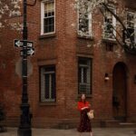 Courtney Halverson Instagram - It really is the best time of the year 🧺🥀🧋 Put on a cute outfit and I’ll be outside your door in 20 minutes, let’s go! Wearing my uniform for the season which includes a floral midi skirt (groundbreaking) with a little cardigan (in case it’s chilly) and a basket (to put my flowers and little treats in). All from @sezane, of course 🥀 . . #feminineenergy #sezanelovers #parisianstyle #romanticstyle #basketpurse | gifted pieces featured