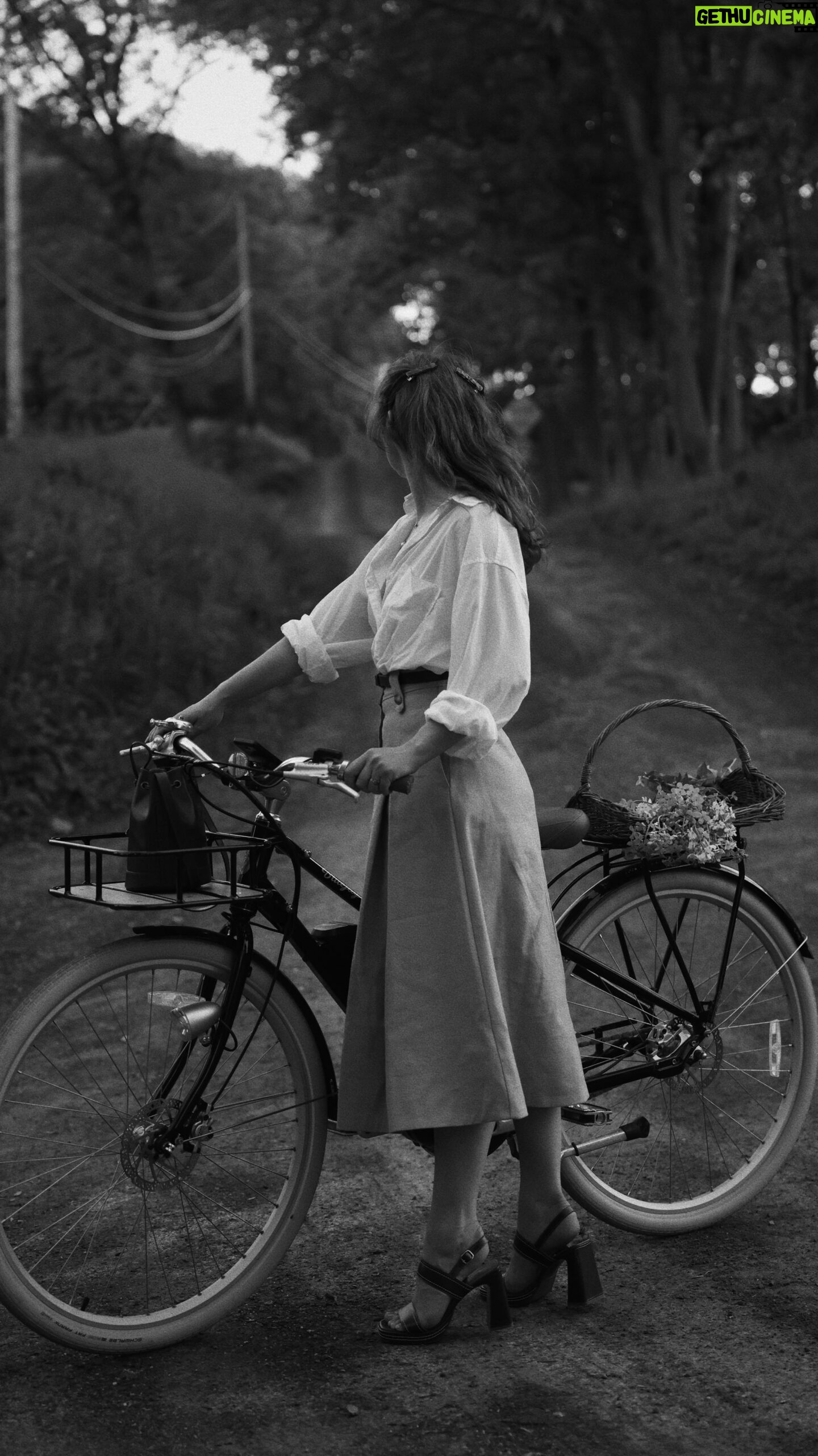 Courtney Halverson Instagram - Evening bike rides have quickly become one of my favorite things about this time of year. A way to enjoy the sunset and see wildflowers (the violets are blooming at the moment) and visit the neighbors - and by neighbors I mean the goslings in the pond down the road and the horses in the field just up the hill. I wore some new and old favorites from my closet and after looking back at this outfit have realized it was probably heavily influenced by Evelyn from The Mummy, and I have to say I don’t mind that. #romanticstyle #cinematicmoments #classicstyle #sezanelovers #bikeriding #softgirlsummer wearing @sezane