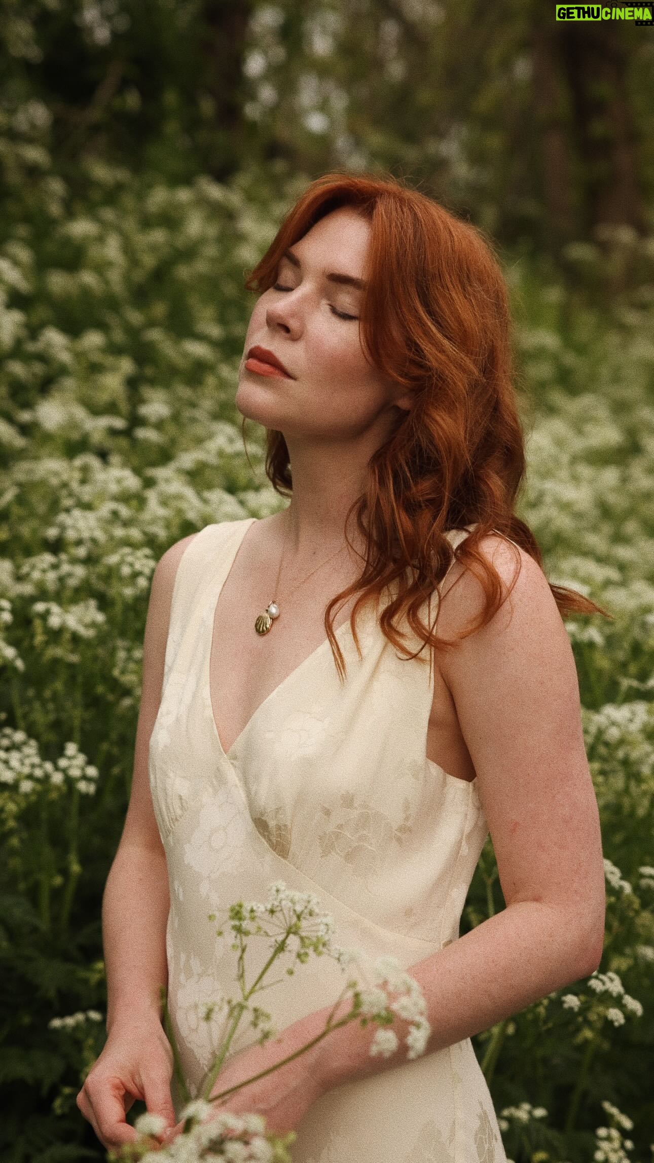 Courtney Halverson Instagram - Falling for the beauty of late spring, and though I’m not quite ready for the warmth of summer, it does have its own special kind of beauty. Long days that pair beautifully with long sunsets, cool breezes that turn up at just the right time, butterflies during the day that trade places with fireflies in the evening. Living somewhere with distinct seasons has been the greatest discovery for this girl from California; I’ll forever wax poetic about it. 🌿 . . . #romanticstyle #romanticizetheseasons #thehudsonvalley #fairycore #welovecoco | wearing @rixo, makeup is @saiebeauty slip tint, @benefitcosmetics liquid blush, @iliabeauty lip crayon, @welovecoco highlighter eyeshadow