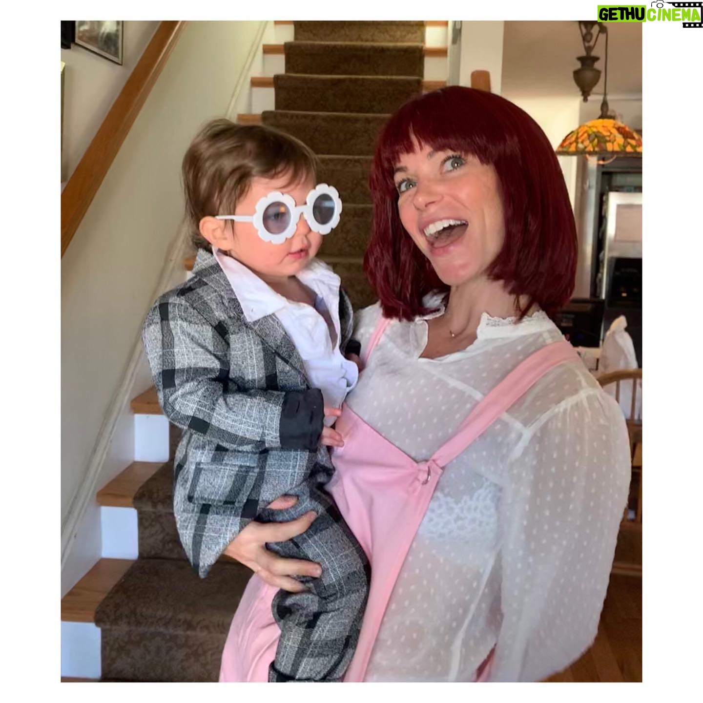 Courtney Henggeler Instagram - There was a time when I saw Halloween as a time to exclusively not wear pants. Since becoming a mom I now use that pant-less energy and devote it to forcing my daughter into costumes for which she will never understand. And bowl haircut wigs. I’ve replaced my scantily clad costumes with unflattering wigs. Because I’m a grownup goddamnit. #dontgobreakingmyheart #eltonjohn&kikidee