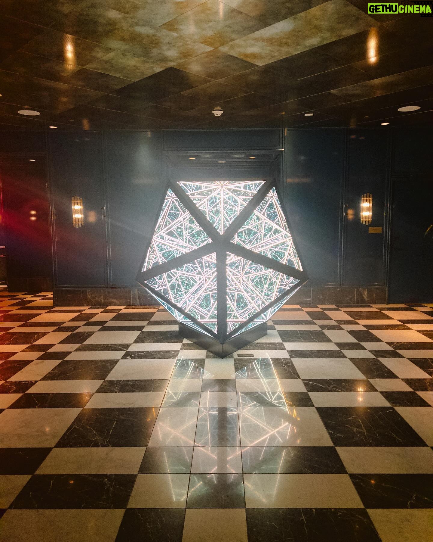 Courtney Hope Instagram - 💭 PORTAL OF POSSIBILITY (( or Polaris? A Hedron? OOP? 😜🔻) 🪞 A mirror into the intricacies and complexities of who we are. This was what it represented to me and why I couldn’t stop staring.. It was exactly what I saw when I rounded the corner and saw this geometric bubble. I was captivated. I didn’t want to look away. I felt like it was teaching me and reminding me at the same time. All the different sections and portals, like an echo chamber, mirroring and reflecting off one another, yet representing an individuality where not one was an exact replica of another. Like the schemata of a brain, a neural network, visceral, cognitive and somatic memory storage, the rabbit hole of intrusive and over processed thought, an array of magical imaginative possibilities, the windows to the soul. I could’ve stared at this for hours, stirring something different in each moment as it was constantly molding and shifting in my awareness of what could be. Do you ever stare at something long enough that it begins to take a different shape? This happens sometimes when I get to know someone better and one day I realize their face begins to change and I start to see them more clearly and authentically. What areas of your life does this happen? Are there places where you can spend a little more time looking at something to allow for a new framework or meaning to unfold?