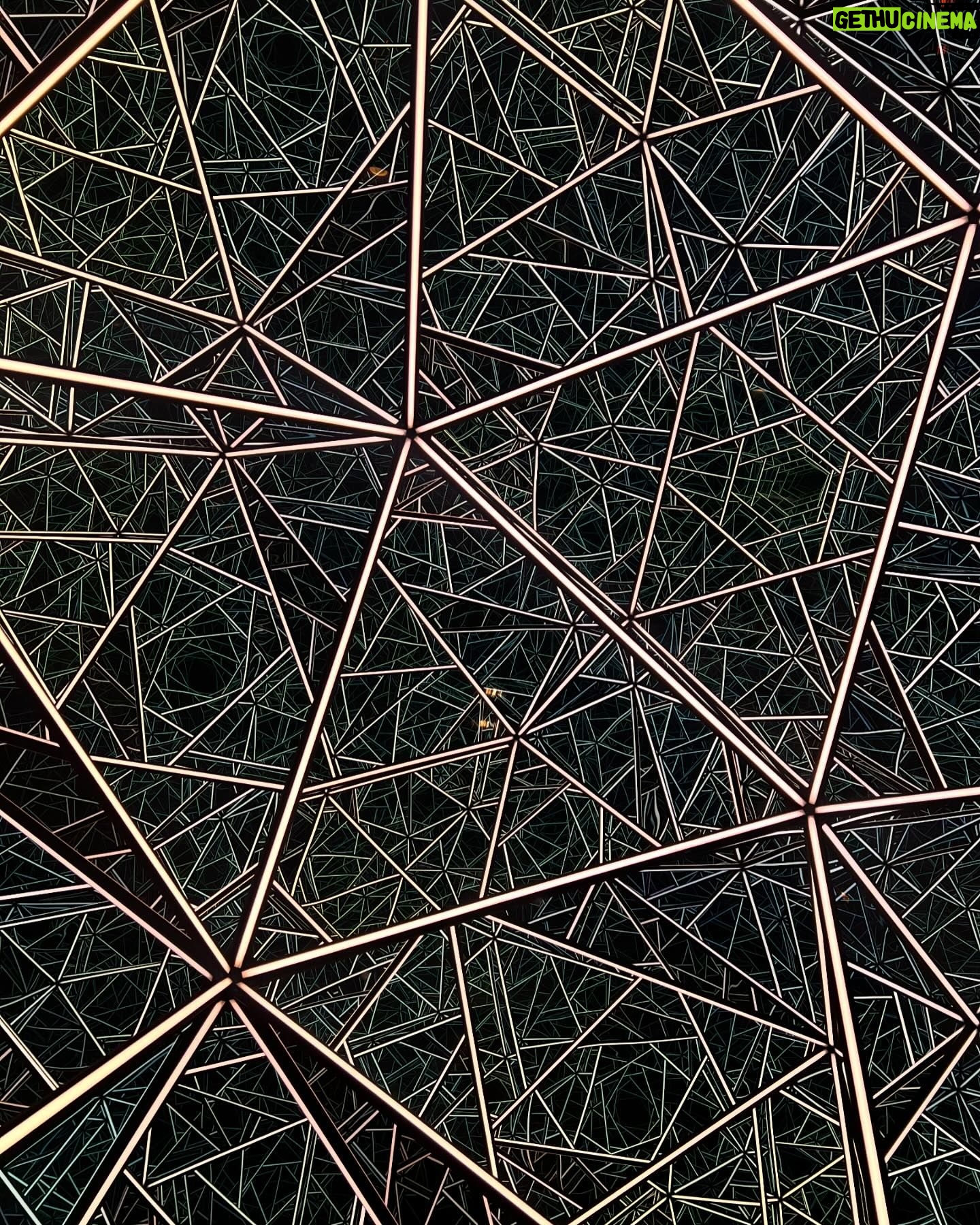Courtney Hope Instagram - 💭 PORTAL OF POSSIBILITY (( or Polaris? A Hedron? OOP? 😜🔻) 🪞 A mirror into the intricacies and complexities of who we are. This was what it represented to me and why I couldn’t stop staring.. It was exactly what I saw when I rounded the corner and saw this geometric bubble. I was captivated. I didn’t want to look away. I felt like it was teaching me and reminding me at the same time. All the different sections and portals, like an echo chamber, mirroring and reflecting off one another, yet representing an individuality where not one was an exact replica of another. Like the schemata of a brain, a neural network, visceral, cognitive and somatic memory storage, the rabbit hole of intrusive and over processed thought, an array of magical imaginative possibilities, the windows to the soul. I could’ve stared at this for hours, stirring something different in each moment as it was constantly molding and shifting in my awareness of what could be. Do you ever stare at something long enough that it begins to take a different shape? This happens sometimes when I get to know someone better and one day I realize their face begins to change and I start to see them more clearly and authentically. What areas of your life does this happen? Are there places where you can spend a little more time looking at something to allow for a new framework or meaning to unfold?