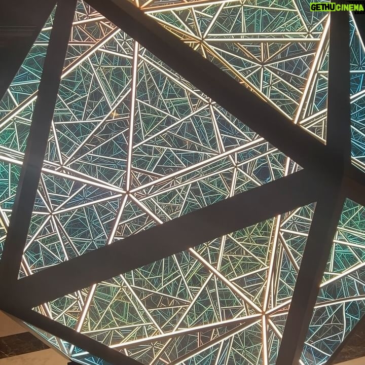 Courtney Hope Instagram - 💭 PORTAL OF POSSIBILITY (( or Polaris? A Hedron? OOP? 😜🔻) 🪞 A mirror into the intricacies and complexities of who we are. This was what it represented to me and why I couldn’t stop staring.. It was exactly what I saw when I rounded the corner and saw this geometric bubble. I was captivated. I didn’t want to look away. I felt like it was teaching me and reminding me at the same time. All the different sections and portals, like an echo chamber, mirroring and reflecting off one another, yet representing an individuality where not one was an exact replica of another. Like the schemata of a brain, a neural network, visceral, cognitive and somatic memory storage, the rabbit hole of intrusive and over processed thought, an array of magical imaginative possibilities, the windows to the soul. I could’ve stared at this for hours, stirring something different in each moment as it was constantly molding and shifting in my awareness of what could be. Do you ever stare at something long enough that it begins to take a different shape? This happens sometimes when I get to know someone better and one day I realize their face begins to change and I start to see them more clearly and authentically. What areas of your life does this happen? Are there places where you can spend a little more time looking at something to allow for a new framework or meaning to unfold?