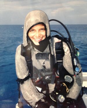 Cristina Zenato Instagram - Day 1 Question 1
A career path like no other! 
In 1994, through a series of coincidences and choices, I landed in the Bahamas to complete scuba diving training, a dream since I was eight. Once here, I decided I didn’t want to go back. I was drawn to the island by the beauty of the ocean, the sharks I had met on my first dive and the lifestyle. I stayed because my heart found home, and my soul found happiness and peace. 
My background is in hotel management and languages, art, history, & literature. It has nothing to do with STEM; I grew up with the notion that women were not allowed in STEM and other more male-oriented jobs like engineering. 
I followed my other childhood dream: speaking all the languages of the world. I stopped at 5, but those languages & my hotel expertise allowed me to find a job to stay. In a week, I quit work, boyfriend, car. I was 22 years old & started from the bottom up. I tried to learn everything in my field, vertically by becoming a more advanced and trained diver & laterally by learning everything from regulator repair to photography, driving boats, & creating moorings. I read books about physics, physiology, & geology I used the little money I made to travel and learn from people working in the fields I was interested in. I kept informed with anything I could put my hands on, living on an island without computers and the internet. I found terrific mentors and tried to soak up as much as possible. Later, I turned back to the studies I never had access to, and that’s how I became a shark ecologist and behaviorist. Arriving where I am now took thirty years of daily work and dedication, overcoming significant challenges, and sticking to listening to my heart 
My work is my passion, and my passion is my work; there is no distinct line.
By trade, I am a diving professional, and by calling a scientist. Loving something makes us want to protect it. It didn’t take much to see that sharks, ocean, caves, and even the pine forest were intrinsically connected and that damaging one would affect the other. Conservation is my lifestyle, not once a day action, but that’s for another post.
Archive image 1997