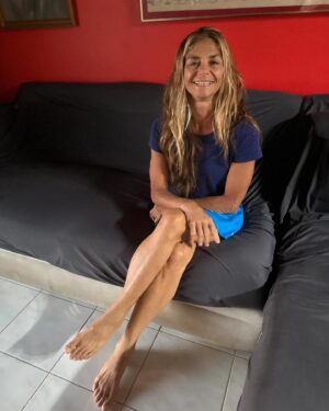 Cristina Zenato Instagram - Day 7 Question 7
The physical consequences of 30 years spent underwater and in the elements. 
My hair is bleached blond from sunlight and salt, but it’s not a big issue besides being a tad dry.
I have a Pterygium, known as a surfer’s eye, in my left eye, combined with a constant redness in both eyes caused by sun exposure. 
I am missing a tooth that was not closed correctly and cracked upon ascent due to the trapped air; I never replaced it because, at the time, it meant spending more than six months out of the water. 
Ear tinnitus might be the worst consequence. It is sometimes loud and even prevents me from sleeping.
I have a lot of extra wrinkles due to sun exposure, but I don’t care; they are more the story of my life. 
My hands, according to doctors, present signs of arthritis; I only see powerful hands with somewhat large knuckles; I have mild carpal tunnel from carrying tanks
I have been bent twice, early in my career, for diving too much, for too many consecutive days, and most likely not drinking enough water. Those hits have no significant consequences, but they make me attentive to my diving (No PFO)
There are also general consequences that are part of physical work, from tightness in the shoulder muscles to sometimes dropping something heavy on a toe or trapping a nail somewhere and watching it as it goes from red to purple to even falling, the tiredness brought by a day of diving, and carrying gear, together with the mental strain related to the planning and execution of these dives. 
Being an active diver and sportsperson has allowed me to be strong, to have muscles that keep my bones healthy and flexible, and to recover quickly from a hard day or days.
One of the best results of this life is not having to deal with hammer toe, a major hereditary issue in the women in my family, by mainly living barefoot, balancing on boats, and walking over uneven terrain without constricting shoes.
My healing is through my yoga practice. It prevents tingling in my hands from carpal tunnel, repositions what I push out of place when hiking and carrying loads, and soothes the body while keeping it strong and I love all of it. 💕