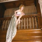 Dakota Schiffer Instagram – 006: The Mane Event, Love your hair hope you win!
“curtain call”

wig- @wigchapel 
film- @llyr.evans 
dress- @ros.ette 
embellishment- @4bihaywood and myself! 

This look is so special to me. My twin and I had our femininity policed massively growing up and had all our “girl” toys taken from us along with being told to change the way we talked walked and dressed by our family. After this our Grandma, who used to sneak dolls for us from the charity shop she worked at, let us play with the curtain tassels in her house and pretend that they were our hair. She never questioned our femininity and was one of the first family members who let us know it was ok to be feminine so to turn it around into a look was very emotional for me! This look is a love letter to anyone who had their femininity policed growing up. Even when we were being actively taught to be ashamed of the way we were naturally, it’s small moments like this from childhood that really stick with you. I know it’s silly but wearing curtain tassels on my head again was a very full circle moment! Reclaiming that femininity was so important for me to represent and I’d like to thank our Grandma for letting us be ourselves growing up! (and for also not getting angry at us when we took scissors to her curtain tassels!) 💖💖💖