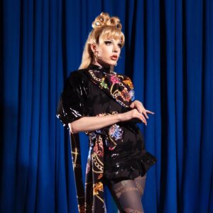 Dakota Schiffer Instagram - 005: Design Challenge, Cohesive High Fashion looks

photo- @gregbaileyphoto
inspo- @versace & @richardquinn
hair- me!

This win was so important to me! A Versace meets Richard Quinn fusion was the idea within about 5 mins and @bby.ldn was the best teammate I could’ve asked for! From Baby talking me through a meltdown after trying to make leggings for 3 hours, me whipping this dress together pretty much after filming confessionals in the morning, styling both our wigs at 5am before we got the coach to the studio and hot gluing bows to each other 3 mins before the runway, this challenge was chaos but I wouldn’t change it for the world! 

I also wanted to wait till this episode to say that I really struggled to keep up financially with my runways. I’ve seen a fair bit of criticism towards my “simple” aesthetic, which I think is a combination of financial constraints, the extremely high standard of queens this season and getting many of my fashion references from runways and less “draggy” aesthetics. It sucks because I would’ve loved to bring my grandest ideas to life but it wasn’t possible for many runways. It wasn’t in the episode but i remember saying in confessionals “take everyone’s wallets away, and I’ll come out on top”. Winning the design challenge as a self proclaimed fashion queen after week one felt like the perfect redemption! Thank you for all the love and support 🖤💛🖤

Also go check out signed prints of these looks @gregbaileyphoto link in their bio!