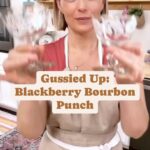 Damaris Phillips Instagram - This Thirsty Thursday cocktail was inspired by a recent #thriftstorefind and a woman owned Bourbon Brand @bossmollybourbon Blackberry Bourbon Punch Ingredients: 1/2 cup seedless blackberry jam 1 cup bourbon 1/4 cup fresh lemon juice 1/4 cup triple sec 1/2 cup blackberry liqueur or blackberry wine 1 cup blackberry sparkling water Ice cubes Lemon slices for garnish Instructions: seeds. In a pitcher, stir together the blackberry jam, bourbon, lemon juice, triple sec, and blackberry liqueur until well combined. Chill Just before serving, add to 4 oz to shaker with ice. Shake to chill completely. Pour into a champagne coupe and top with sparkling water. Garnish with lemon slice and enjoy! Makes 4 servings. #thrifting #thrifted #thriftedhome #thriftstorefinds #thriftingcommunity #thriftshop @libbey
