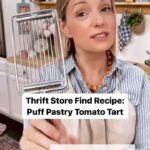 Damaris Phillips Instagram - What do you think? And also you should save this recipe! Puff Pastry Tomato Tart Ingredients: 1 sheet of puff pastry, thawed 1/3 cup pesto 1 cup smoked mozzarella, shredded 2-3 fresh tomatoes, thinly sliced 1 egg, beaten (for egg wash) 1-2 tablespoons Everything Seasoning Instructions: Preheat your oven to 400°F (200°C). Line a baking sheet with parchment paper. Unroll the thawed puff pastry sheet on a lightly floured surface. Using a rolling pin, gently roll out the puff pastry to smooth any creases and to slightly enlarge it. Move to the prepared baking sheet. Spread the pesto evenly over the puff pastry, leaving 1/2 inch border. Sprinkle the shredded smoked cheese evenly over the pesto layer. Lay the tomato slices over the cheese, slightly overlapping if necessary. Arrange them in a visually appealing pattern. Brush the edges of the puff pastry with the beaten egg. Sprinkle the Everything Seasoning generously over the entire tart, including the tomatoes and the edges of the puff pastry. Bake 25-30 minutes, or until the puff pastry is golden brown and puffed up, and the cheese is melted and bubbly. Remove the tart from the oven and let it cool slightly on the baking sheet before transferring it to a cutting board. Slice into squares or rectangles and serve warm or at room temperature.
