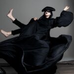 Daphne Guinness Instagram - Lee is looking down and smiling @ladygaga. My cape is having further adventures befitting a Highwayman! Outsiders Forever! I love you♥️