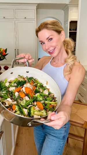Darnell Cox Instagram - 🥗Meal Prep time! 

🎙️If you missed yesterday’s Instagram Live show on Diet & Longevity, make sure you check that out on my story highlight! You may be shocked 😱on my take on counting Macros (specifically protein). 

😃On today’s show, join me as meal prep my weekly lunches! 

🌅My first meal of the day is the most important, for sure! But that meal, for me, is LUNCH! 🍽️

⏱️I’ve been doing Internittent Fasting for 30  years! 

My MORNING HEALTHY AGING ROUTINE: 
🌅I wake up
☀️get outside to get early morning light in my eyes. 
🍵drink a thermos full of green tea.
🥶take a cold plunge
🚨A little red light therapy 
🏋️‍♀️Exercise on an empty stomach 
🥗THEN I eat as many colorful plants as I can for LUNCH around 1pm.

Here is what I made for my next 3 lunches..

MIXED VEGGIE STIR FRY:
2 tablespoons olive oil
1/2 white onion 
4 cloves garlic 
3 stalks broccoli chopped
2 stalks celery sliced
1-2 cup asparagus chopped
1-2 cup green beans 
1 cup mushrooms sliced
3 carrots sliced 
Dash of low sodium soy sauce 
1/2-1 container firm tofu cut into cubes. 

Directions: 
Stir fry the harder vegetables on medium heat with  olive oil for about 10 minutes, maintaining the crunchy texture as they will be reheated for the next few days. Add mushrooms and tofu. Cook 5 more minutes. Add soy sauce and cook a few more minutes. Sprinkle with black sesame seeds. 

👩‍🍳This recipe changes every week, depending on which vegetables are local, in season, or I can find organically grown. 

😃Make sure you check out the live show I did on diet fads and how reducing your protein intake can help you live longer & better. 

Follow for more ways to look, feel, and function your best at EVERY age! 

#veggiestirfry #healthyaging #50plus #mealprep #livelongerbetter