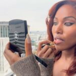 DeWanda Wise Instagram – 💄Lovah. 

{De applies lipstick in natural light.}