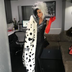 Debbie Matenopoulos Instagram - A few of my favorite Halloween costumes over the last couple of years.  I was so obsessed with my Cruella De Vil costume that I literally wore it all week wherever I went. And I equally loved when I was Sally from “Nightmare Before Christmas”. Except right after we shot that show, I had to get on a plane to fly to NYC to interview Barbara Walters and getting that blue paint off of my face and body was not easy. I still had some blue on me during the BW interview. 😂. Our hair, makeup and wardrobe team on Home and Family were second to none. @kdestyle @francinevaldivia @janbping killed it with these looks. And I have to say, the final picture in this series seems very appropriate.  Almost a bit of foreshadowing.  Look closely at the tombstone 😳🤪😉 😂 #halloween #halloweencostume #halloweenmakeup