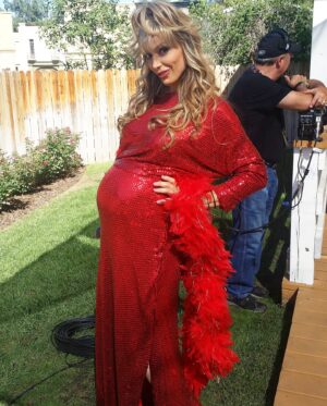 Debbie Matenopoulos Instagram - Who’s ready for a good laugh this Sunday morning??? That one time on Home and Family when I was 9 months pregnant with Alexandra and my executive producer thought it would be a good idea to dress me like Charo @officialcharo because we had the whole cast of “The Love Boat” on including guest star Charo that day and she would be singing a song for us.  I mean… the things my boss would make us do for a laugh 🤭🤪 Charo loved it!!! I on the other hand thought my water would break at any moment.  My hair/makeup and wardrobe girls clearly had a field day with this one. @francinevaldivia thank you for sending this to me this morning and starting my day with a good laugh and a great memory.  Man, we had the greatest time on that show. In the famous words of Charo “Coochie Coochie Coo”. 😂😂😂
