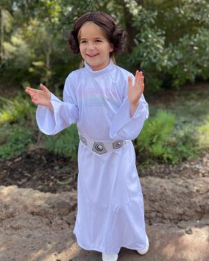Debbie Matenopoulos Instagram - Throw back to all of Alexandra’s Halloween costumes since year one.  I have to say the Greek Yiayia is still my very favorite. Clearly it was NOT her favorite. Lol.  We even made a walker out of PVC pipe. 😂😂😂. Happy Halloween everyone. #yiayia #ghost #lamb #bumblebee #unicorn #poppytroll #princessleia