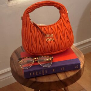 Demi Singleton Instagram - bags and books 🧡📚👓

@miumiu 
#MiuMiu #MiuWander