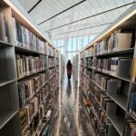 Dewi Lestari Instagram - “Iqra”. Bacalah. Tulisan itu terpatri besar di pintu Heritage Library, bagian dari Qatar National Library (QNL) yang sempat saya kunjungi saat di Doha. If visiting QNL should be the sole reason to fly 8 hours from Jakarta, I would still go in a heart beat. This library is so majestic in many ways. The breath-taking architecture, the awesome technology, the rich collection, and the inviting open space, I was just lost for words. Bisa dengan mudahnya saya bayangkan tinggal seminggu di Doha (bahkan lebih), hanya untuk bolak-balik nongkrong dan kerja di perpustakaan yang fasilitasnya serba canggih dan serba gratis ini. Thank you @indonesiaindoha, Kelly and Huseyin for providing me such insightful trips around the library. This is totally one of my biggest highlights in Doha. Cita-citaku nambah satu: buka laptop di sini bersama kedua anakku, lalu kerja bersama 🥺❤️ Eh… nambah satu lagi deng: sharing dan talkshow di auditoriumnya QNL. YUK, BISA, YUK! 🔥 #QatarNationalLibrary #Doha #Qatar