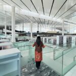 Dewi Lestari Instagram - “Iqra”. Bacalah. Tulisan itu terpatri besar di pintu Heritage Library, bagian dari Qatar National Library (QNL) yang sempat saya kunjungi saat di Doha. If visiting QNL should be the sole reason to fly 8 hours from Jakarta, I would still go in a heart beat. This library is so majestic in many ways. The breath-taking architecture, the awesome technology, the rich collection, and the inviting open space, I was just lost for words. Bisa dengan mudahnya saya bayangkan tinggal seminggu di Doha (bahkan lebih), hanya untuk bolak-balik nongkrong dan kerja di perpustakaan yang fasilitasnya serba canggih dan serba gratis ini. Thank you @indonesiaindoha, Kelly and Huseyin for providing me such insightful trips around the library. This is totally one of my biggest highlights in Doha. Cita-citaku nambah satu: buka laptop di sini bersama kedua anakku, lalu kerja bersama 🥺❤️ Eh… nambah satu lagi deng: sharing dan talkshow di auditoriumnya QNL. YUK, BISA, YUK! 🔥 #QatarNationalLibrary #Doha #Qatar