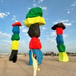 Dewi Lestari Instagram - The 974 Beach, Doha. More than one kilometer stretch of white, superclean beach. Yang bikin beda, ya, batu warna-warni ini. Gimana nyusunnya, ngewarnainnya, saya lama di sini karena mikirin itu. Bukan karena foto-foto. Bukan 😄