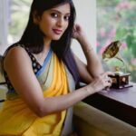 Dhanalakshmi Saminathan Instagram - முதல் பார்வை நெஞ்சில் என்றும் உயிர் வாழுமே 🤍 Shot by : @tru_the_lens_with_monk Saree: @askcouturesaree Styled by: @style_with_abi . . . #instagood #instagram #instadaily #portrait #picoftheday #tamil #book #yellow #sareeseries #sareestyling #desi #pinterest #vintage #sareecollection #sareecollaboration #featured #fyp #lifestyle #dhanasaminathan #anu