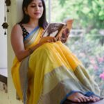 Dhanalakshmi Saminathan Instagram - முதல் பார்வை நெஞ்சில் என்றும் உயிர் வாழுமே 🤍 Shot by : @tru_the_lens_with_monk Saree: @askcouturesaree Styled by: @style_with_abi . . . #instagood #instagram #instadaily #portrait #picoftheday #tamil #book #yellow #sareeseries #sareestyling #desi #pinterest #vintage #sareecollection #sareecollaboration #featured #fyp #lifestyle #dhanasaminathan #anu