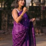 Dhanalakshmi Saminathan Instagram - 🌞🏵️ Saree: @askcouturesaree Shot by : @tru_the_lens_with_monk . . . #instagood #instapost #picoftheday #post #postoftheday #purple #sareeseries #sunsets #portrait #sareestyling #dhanasaminathan