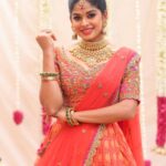 Dharshana Ashokan Instagram – Beautiful @dharshana_ashokan flaunting in orange with pink pleated Embroidered lehenga🌸🌸

Bridal Edit 2024

Ever beautiful @dharshana_ashokan 
Lens @haran_official_ 
Mua @makeup_by_kez 
Hair stylist @banuhairstylist 
Jewellery @challani_jewellery 
Decor @dj_flowers_garlands 🌸